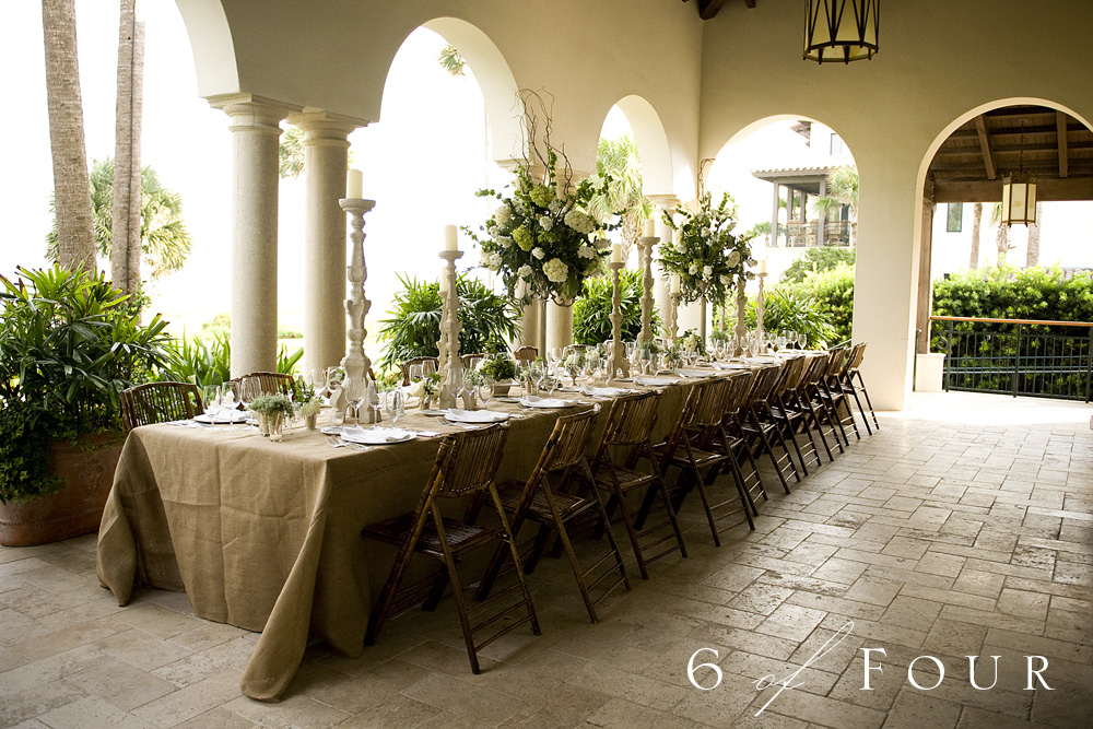 The tables were draped with burlap and the florals included Maiden Ferns and
